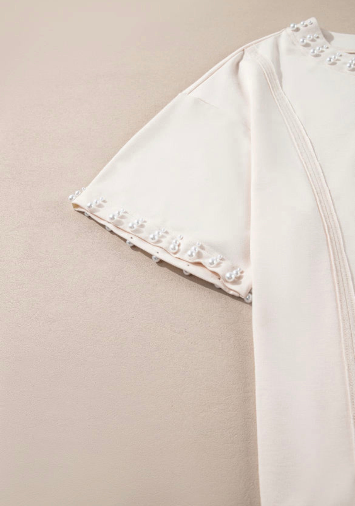 Pearl studded cream top